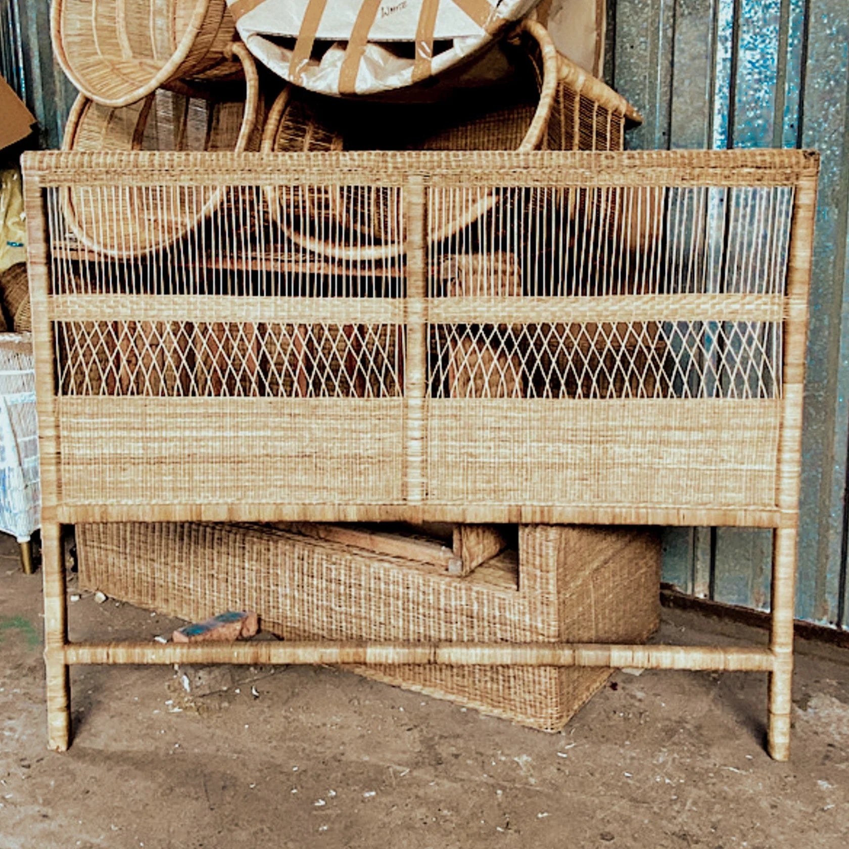 Handmade traditional cane bed head with bamboo weave, inspired by Lake Malawi's tropical evenings and cottage designs.