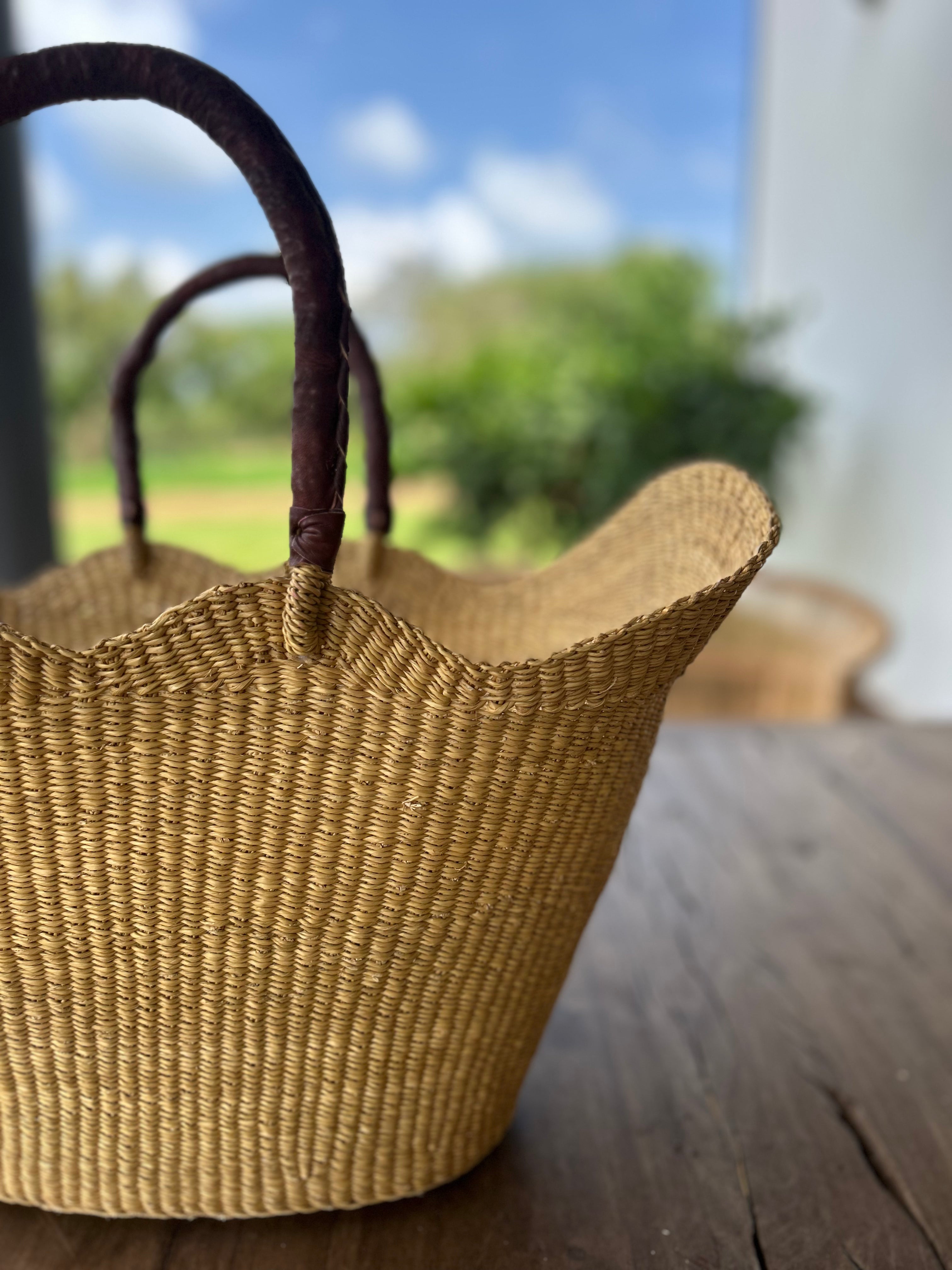 handwoven cane Bolga basket with curves and brown leather handles for beach, market basket, shopper basket