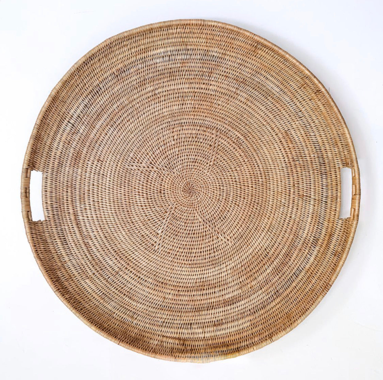 Handcrafted ocean-inspired extra large statement tray with handles, intricately woven from makenge root.