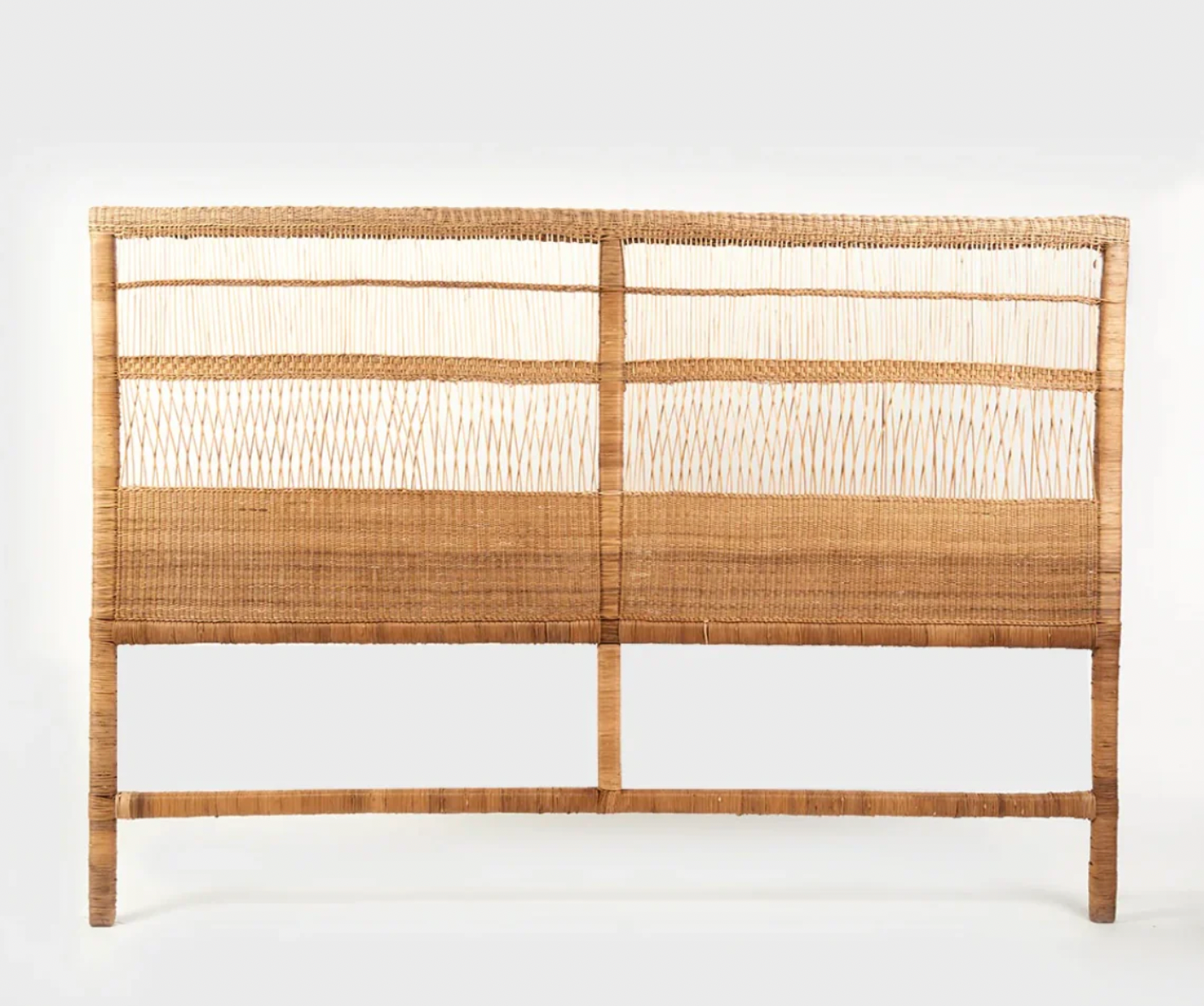 Traditional cane bed headboard with handwoven rattan design, evoking tropical beach vibes and artisanal craftsmanship.