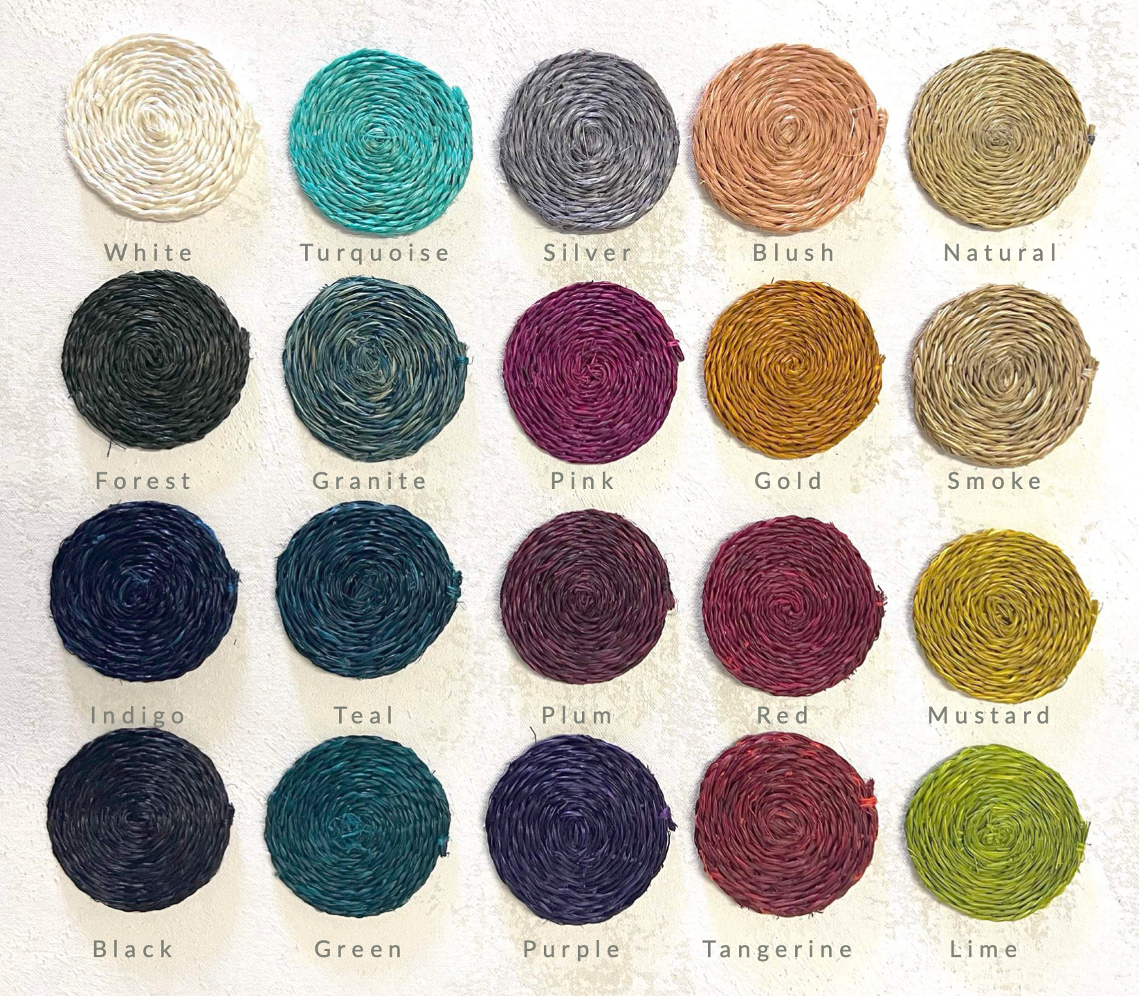 Colorful handwoven placemats in various shades including turquoise, silver, blush, and lime, showcasing vibrant design options.