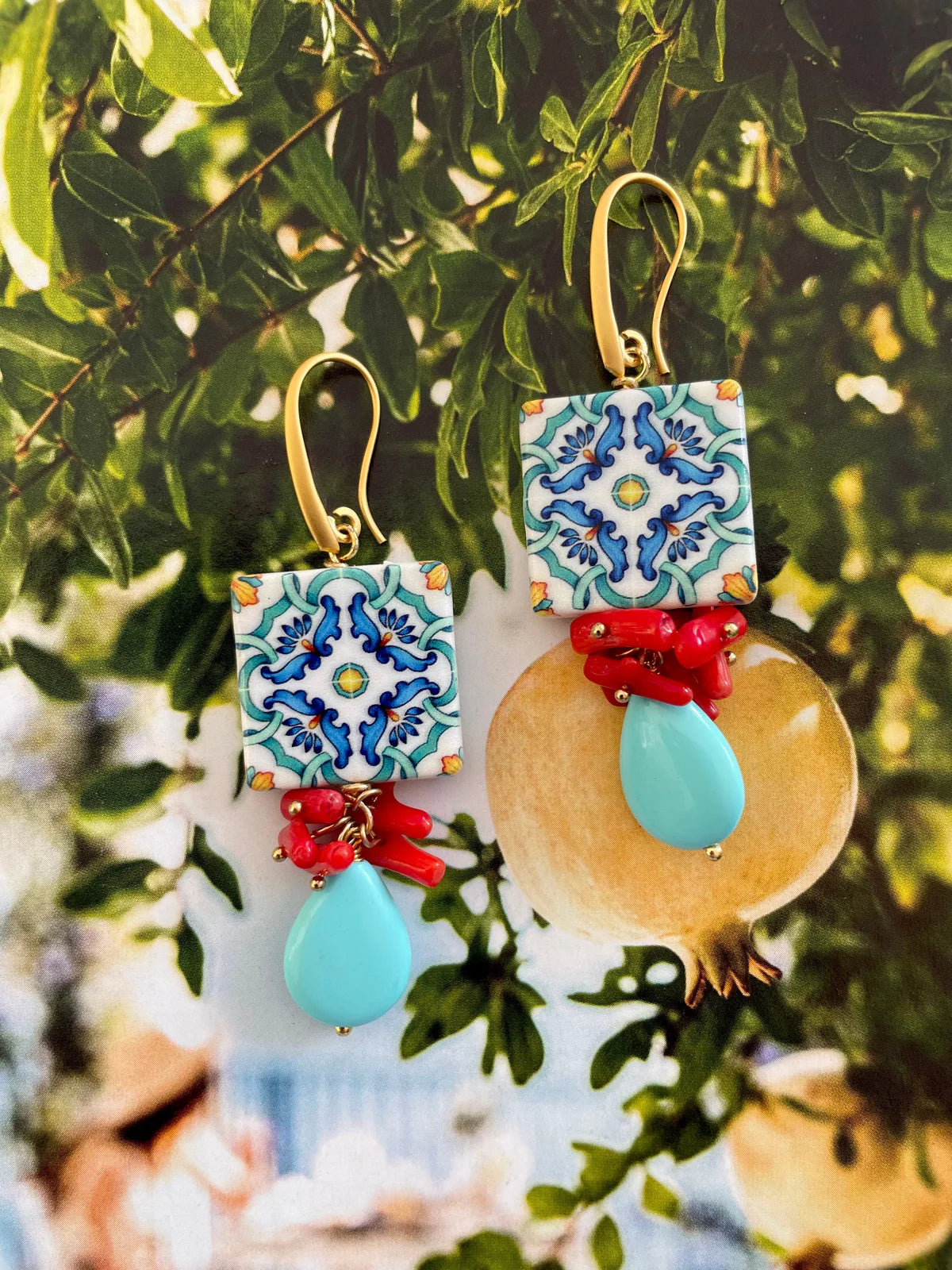 Handcrafted Del Vento Earrings featuring turquoise drops, coral charms, and ceramic tiles with Mediterranean hues. Ocean inspired jewelry.