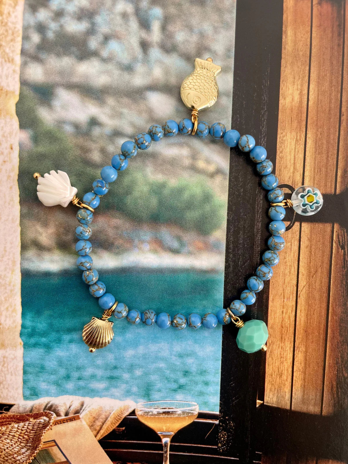 Handcrafted ocean inspired jewelry featuring sea sediment jasper beads and charming sea-themed charms.