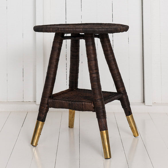 traditional round side table with brass or copper feet dark brown / brass