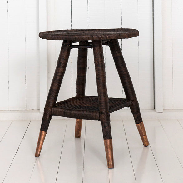 traditional round side table with brass or copper feet dark brown / copper